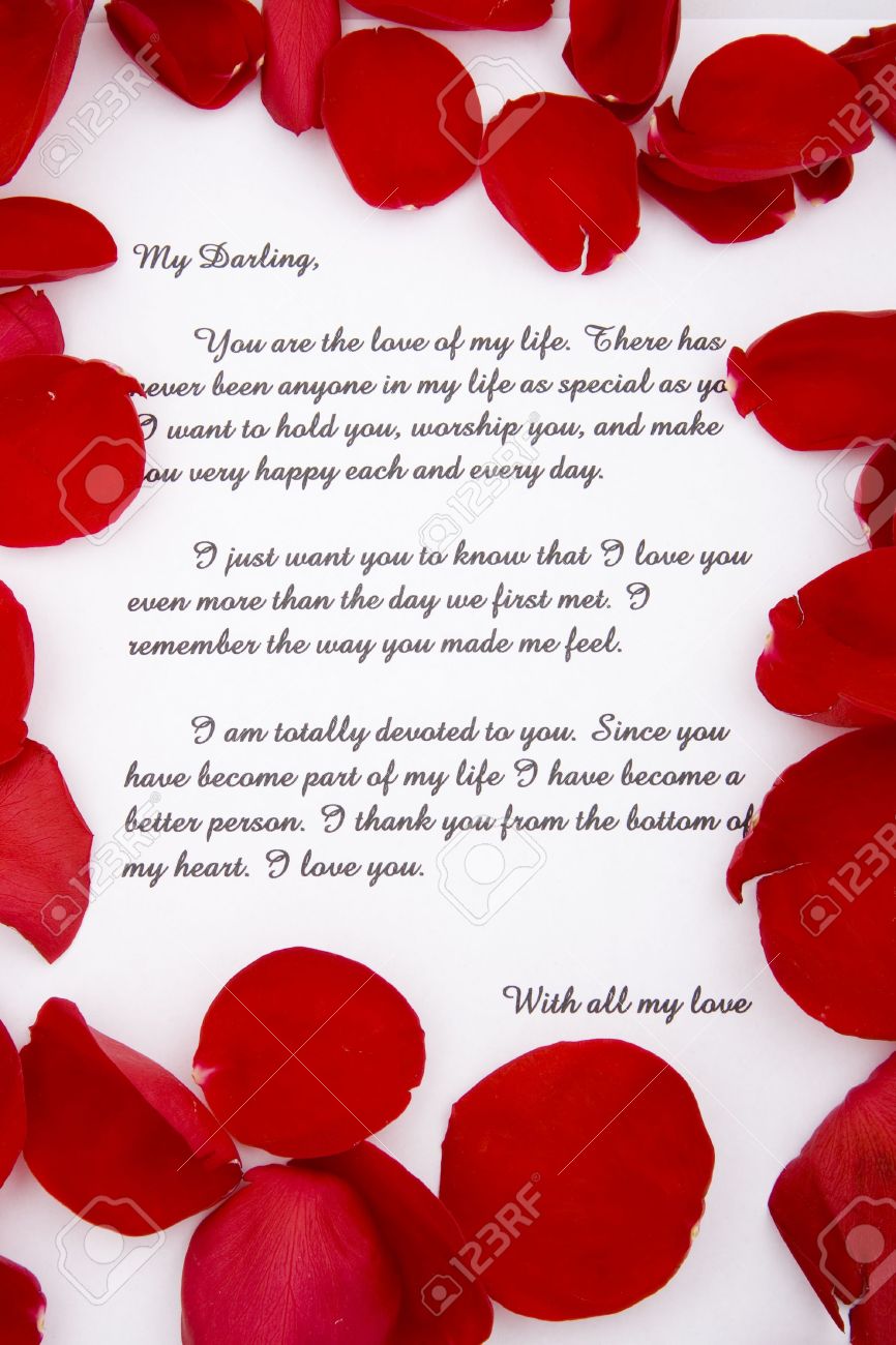 A Romantic Love Letter With Rose Petals. Stock Photo, Picture And 